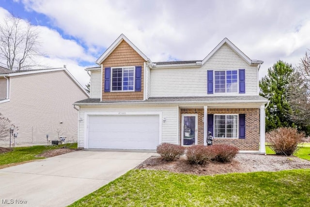 2500 Marlborough Dr, Uniontown, OH 44685 - traditional-style home featuring driveway and an attached garage