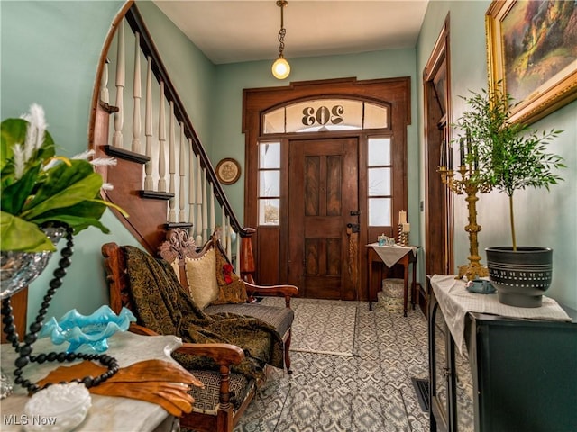 203 W 6th St, Dover, OH 44622 - carpeted foyer entrance featuring stairway