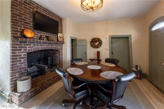 203 W 6th St, Dover, OH 44622 - dining area with wood finished floors and a fireplace