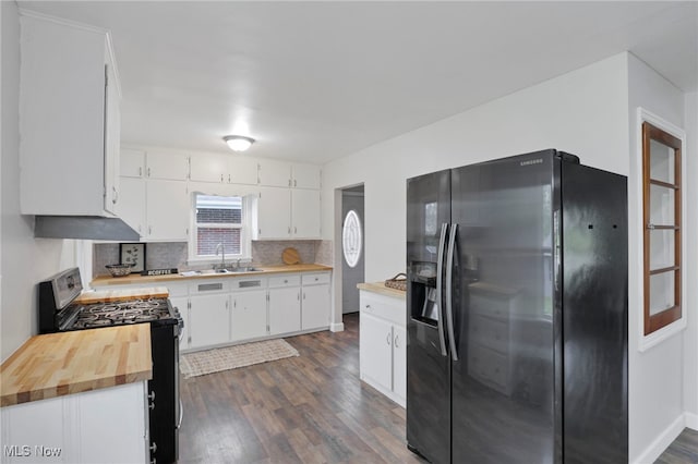 507 Beacon Rd, Newark, OH 43055 - kitchen featuring black fridge with ice dispenser, stainless steel gas range oven, a sink, dark wood-type flooring, and tasteful backsplash