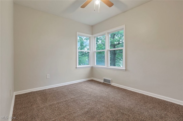 507 Beacon Rd, Newark, OH 43055 - unfurnished room featuring a ceiling fan, dark colored carpet, and baseboards