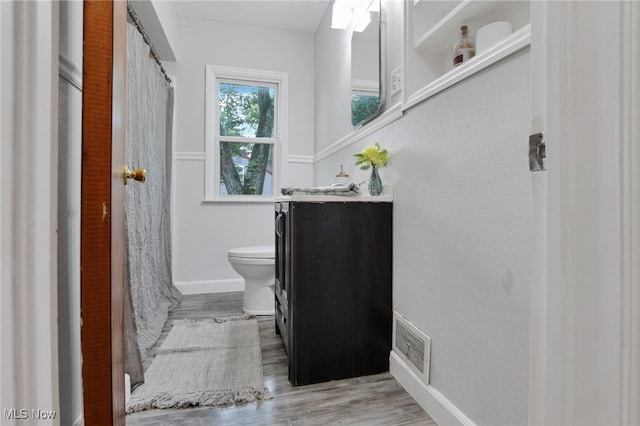 507 Beacon Rd, Newark, OH 43055 - bathroom with toilet, wood finished floors, vanity, and a shower with curtain