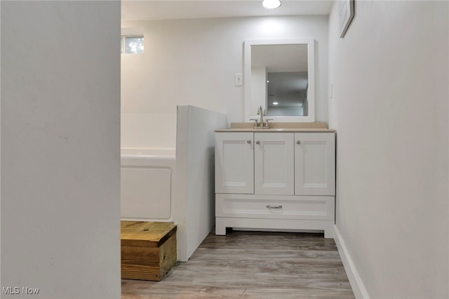 507 Beacon Rd, Newark, OH 43055 - hallway featuring light wood-style flooring and a sink