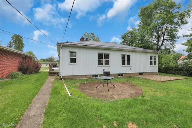 507 Beacon Rd, Newark, OH 43055 - back of property featuring a chimney, a yard, and metal roof
