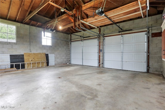 507 Beacon Rd, Newark, OH 43055 - garage featuring concrete block wall and a garage door opener