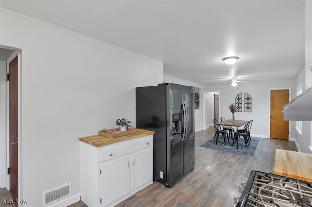 507 Beacon Rd, Newark, OH 43055 - kitchen featuring refrigerator with ice dispenser, ceiling fan, white cabinets, wood finished floors, and baseboards