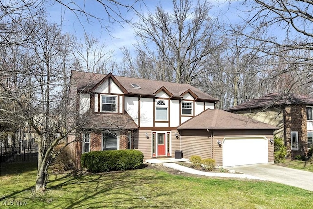 21242 Jonathan Dr, Strongsville, OH 44149 - view of front of property featuring driveway, roof with shingles, fence, an attached garage, and a front lawn