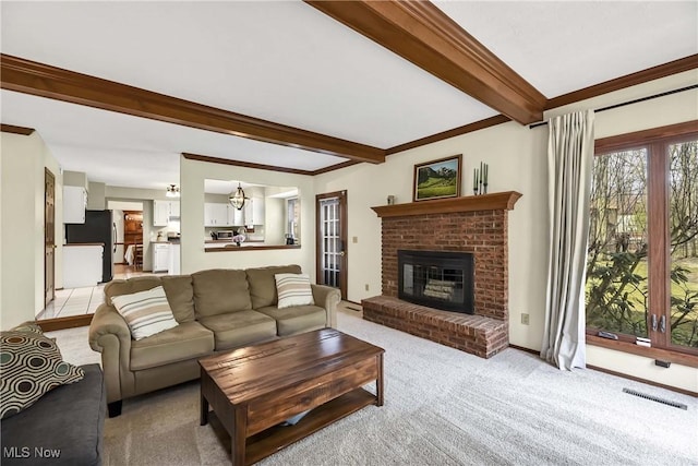 21242 Jonathan Dr, Strongsville, OH 44149 - living room with crown molding, visible vents, beamed ceiling, and a brick fireplace