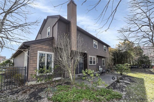 21242 Jonathan Dr, Strongsville, OH 44149 - exterior space featuring a patio, a chimney, and fence