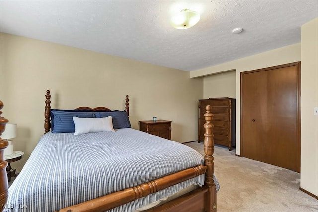 21242 Jonathan Dr, Strongsville, OH 44149 - bedroom with multiple closets, a textured ceiling, and light colored carpet