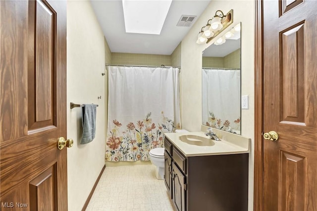 21242 Jonathan Dr, Strongsville, OH 44149 - bathroom with vanity, toilet, a shower with shower curtain, a skylight, and visible vents