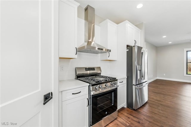 260 Michaels Ct, Cortland, OH 44410 - kitchen featuring stainless steel appliances, wall chimney exhaust hood, dark wood-style floors, light countertops, and white cabinets