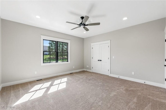 260 Michaels Ct, Cortland, OH 44410 - unfurnished bedroom with light colored carpet, baseboards, recessed lighting, and a ceiling fan