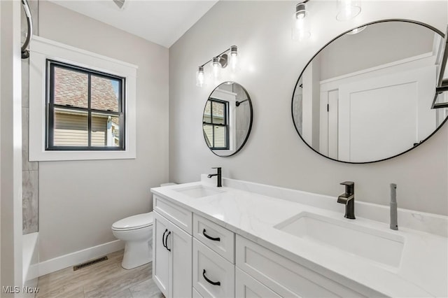 260 Michaels Ct, Cortland, OH 44410 - bathroom with double vanity, toilet, and baseboards