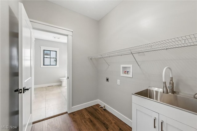 260 Michaels Ct, Cortland, OH 44410 - washroom featuring cabinet space, washer hookup, hookup for an electric dryer, and baseboards