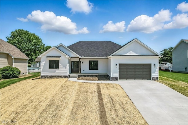 260 Michaels Ct, Cortland, OH 44410 - modern inspired farmhouse with an attached garage, concrete driveway, and a front yard
