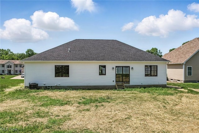 260 Michaels Ct, Cortland, OH 44410 - back of house featuring entry steps, roof with shingles, a yard, and central AC