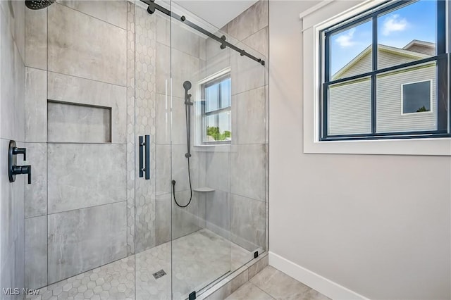 260 Michaels Ct, Cortland, OH 44410 - bathroom featuring a shower stall, baseboards, and tile patterned flooring