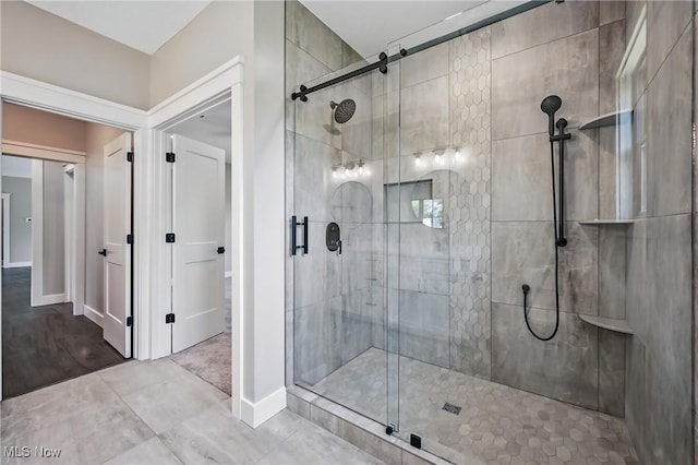 260 Michaels Ct, Cortland, OH 44410 - bathroom featuring a stall shower and baseboards