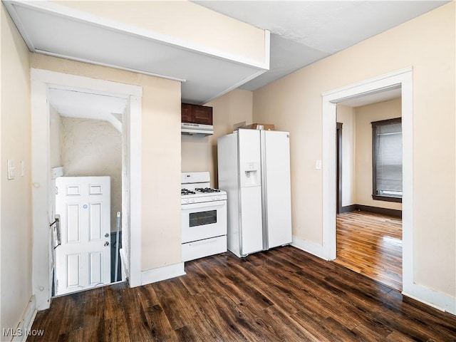 kitchen featuring white appliances, under cabinet range hood, baseboards, and dark wood-style floors