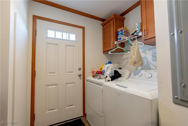 2409 Chelsea Dr SW, Canton, OH 44706 - laundry room featuring washer and clothes dryer, cabinet space, and ornamental molding