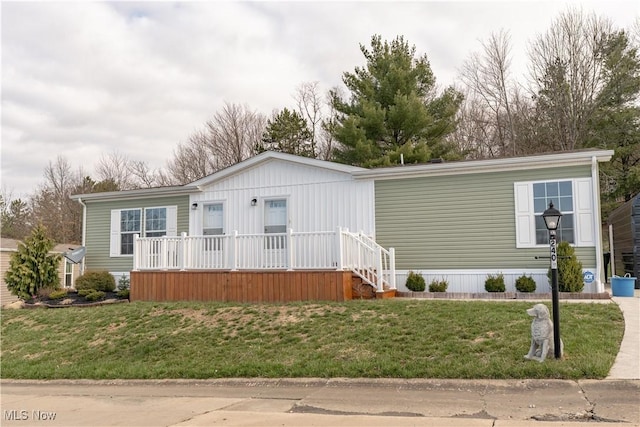 2409 Chelsea Dr SW, Canton, OH 44706 - manufactured / mobile home with a front lawn and a porch