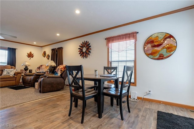 2409 Chelsea Dr SW, Canton, OH 44706 - dining room with recessed lighting, ornamental molding, baseboards, and wood finished floors