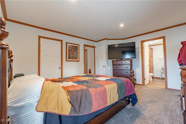 2409 Chelsea Dr SW, Canton, OH 44706 - carpeted bedroom with baseboards, crown molding, and ensuite bathroom