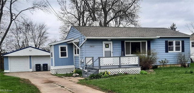 3973 Grafton Rd, Brunswick, OH 44212 - view of front of house featuring an outbuilding, a front yard, a shingled roof, and a garage