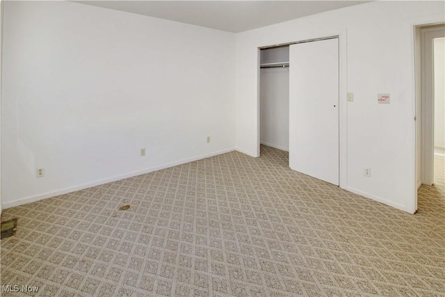 424 Short Prt, Clinton, OH 43452 - unfurnished bedroom featuring baseboards, a closet, and light colored carpet