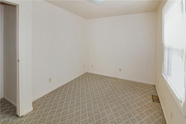 424 Short Prt, Clinton, OH 43452 - spare room with baseboards and light colored carpet