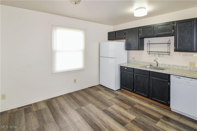 424 Short Prt, Clinton, OH 43452 - kitchen with baseboards, dark wood-style flooring, a sink, and white appliances