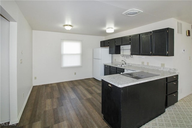424 Short Prt, Clinton, OH 43452 - kitchen featuring black electric cooktop, light countertops, a sink, dark cabinets, and freestanding refrigerator