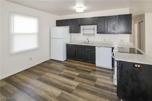 424 Short Prt, Clinton, OH 43452 - kitchen with white appliances, dark cabinets, and a sink