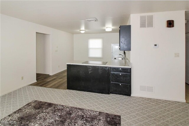 424 Short Prt, Clinton, OH 43452 - kitchen with black electric stovetop, baseboards, visible vents, and refrigerator