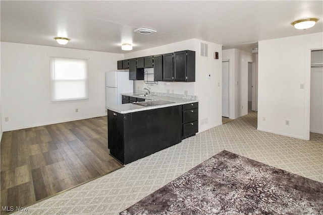 424 Short Prt, Clinton, OH 43452 - kitchen with freestanding refrigerator, light countertops, baseboards, and dark cabinets