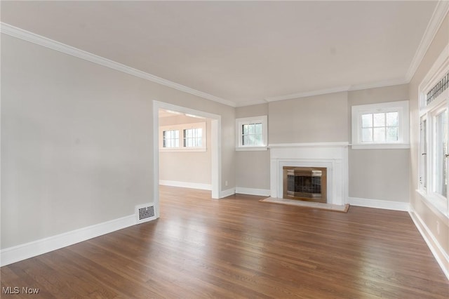 3459 Helen Rd, Shaker Heights, OH 44122 - unfurnished living room with ornamental molding, baseboards, visible vents, a glass covered fireplace, and wood finished floors
