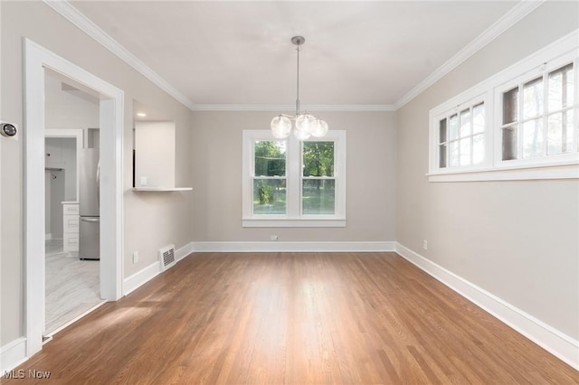 3459 Helen Rd, Shaker Heights, OH 44122 - empty room with baseboards, wood finished floors, and an inviting chandelier