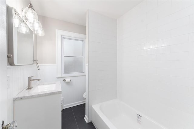 3459 Helen Rd, Shaker Heights, OH 44122 - full bathroom with vanity, toilet, a wainscoted wall, tile patterned floors, and washtub / shower combination