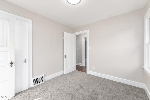 3459 Helen Rd, Shaker Heights, OH 44122 - unfurnished bedroom featuring baseboards, carpet flooring, and visible vents