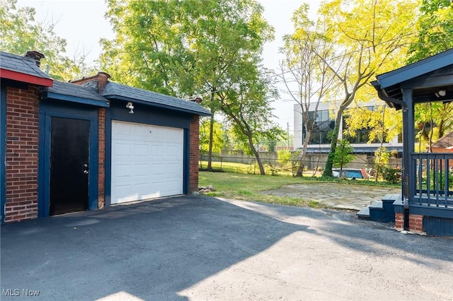 3459 Helen Rd, Shaker Heights, OH 44122 - garage featuring driveway and fence