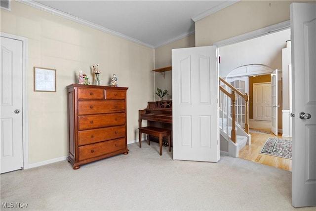 bedroom featuring crown molding, carpet flooring, and baseboards