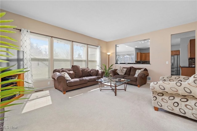 living room with carpet floors and baseboards
