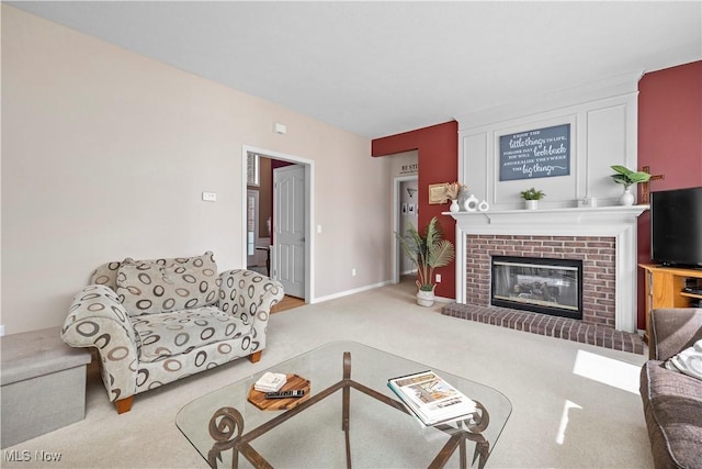 carpeted living room featuring a fireplace