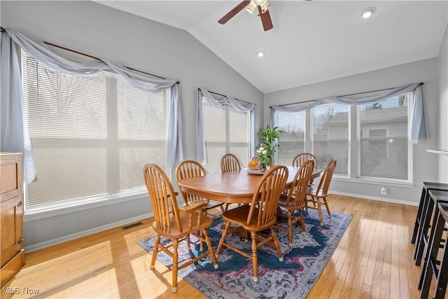 dining room featuring lofted ceiling, light wood-type flooring, a ceiling fan, recessed lighting, and baseboards