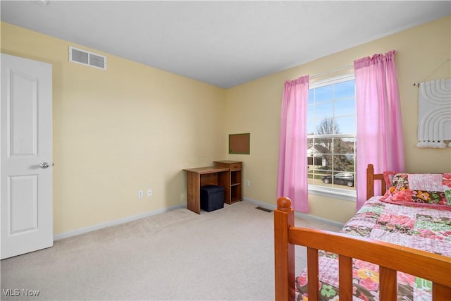 carpeted bedroom featuring baseboards