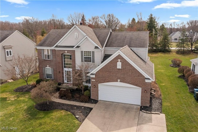 view of front of home with a garage, driveway, brick siding, and a front lawn