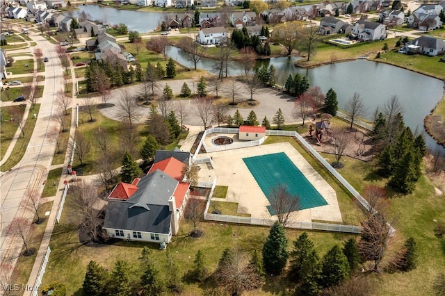 aerial perspective of suburban area with a large body of water