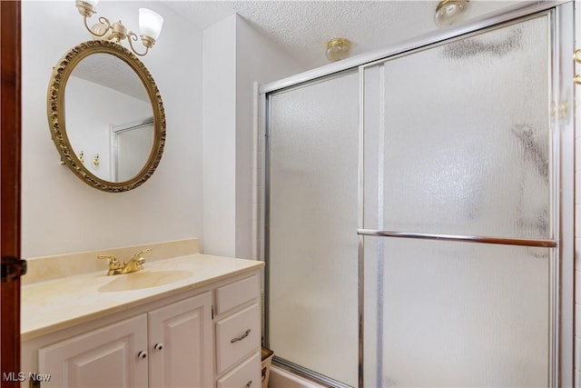 3871 Foskett Rd, Medina, OH 44256 - full bathroom featuring a textured ceiling, a stall shower, and vanity