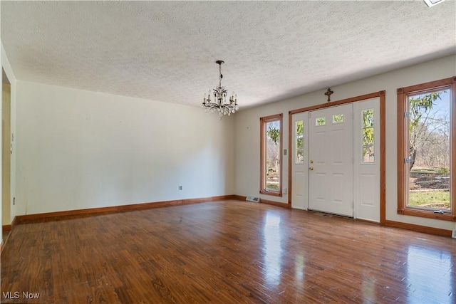 3871 Foskett Rd, Medina, OH 44256 - foyer entrance featuring baseboards, wood finished floors, and a chandelier